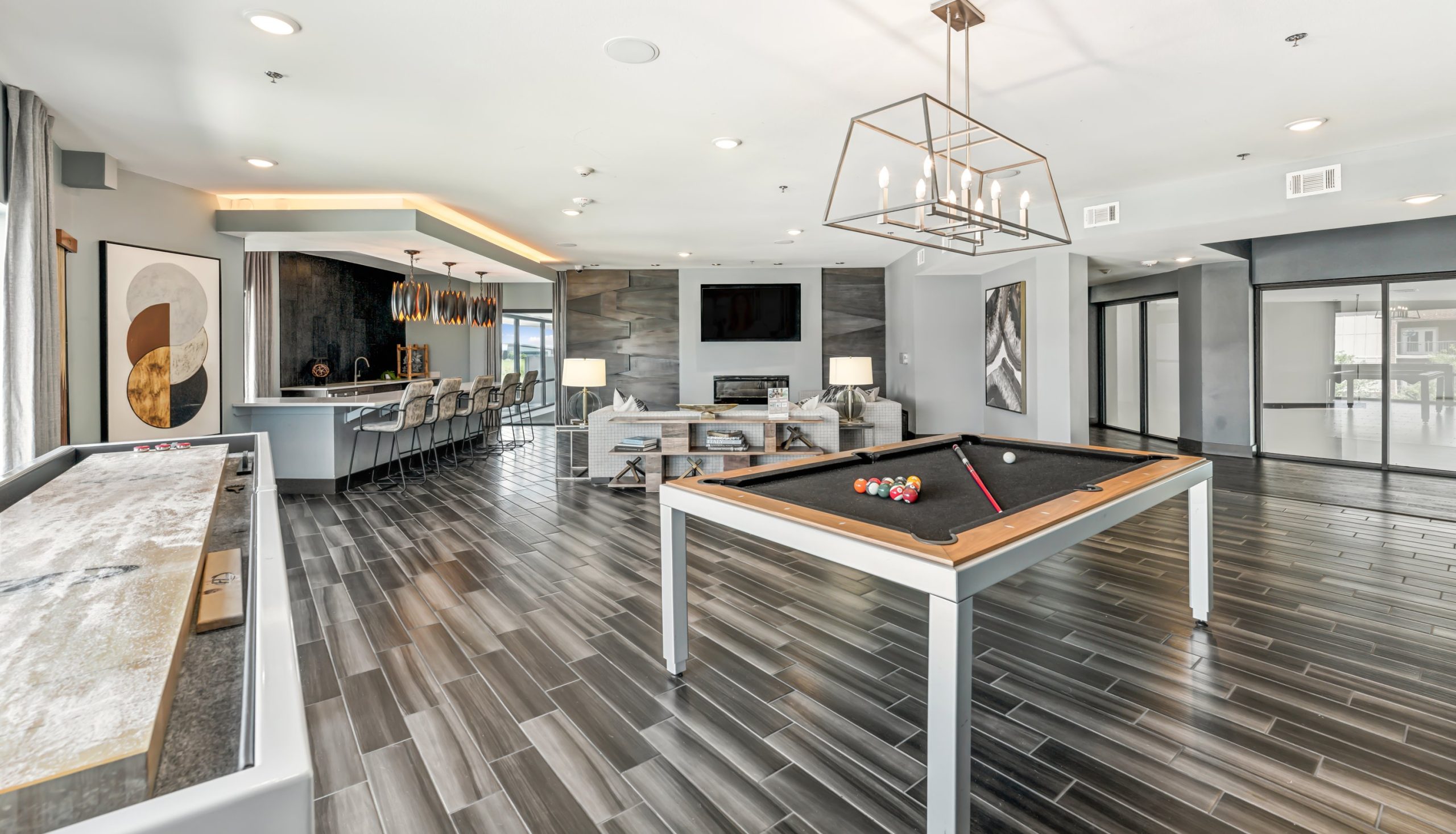 pool table in a living room with a television at The Terra at University North Park