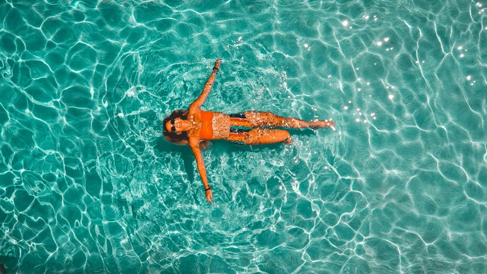 a yellow frisbee floating in the water