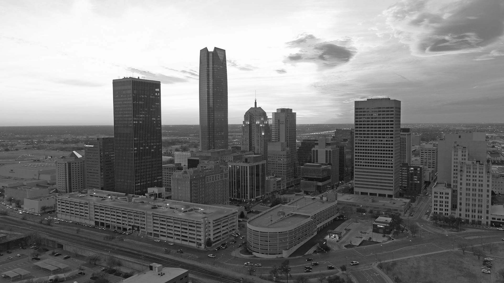 black and white photo of a city skyline at The  First