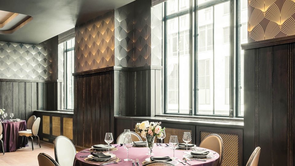 a restaurant with a table set for dinner at The First