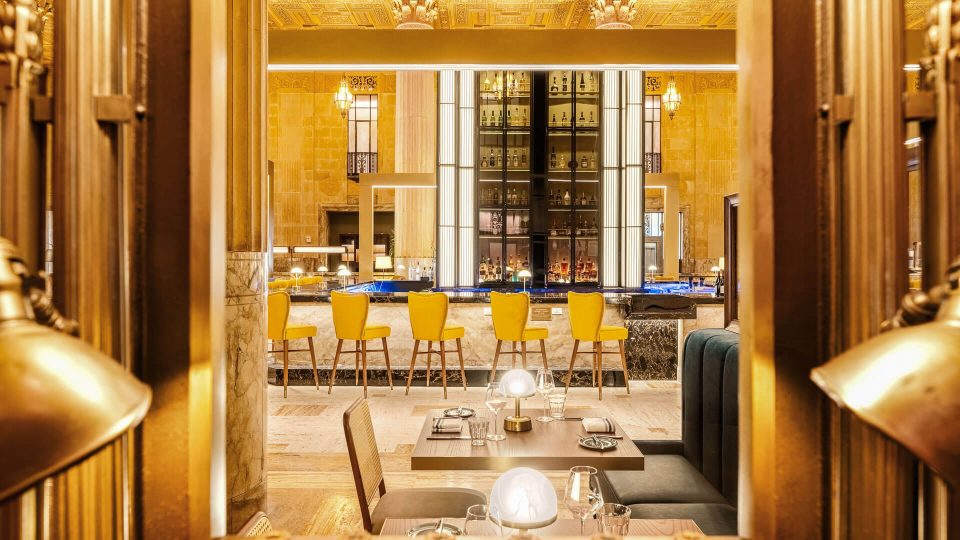 the interior of a restaurant with a large dining area at The First