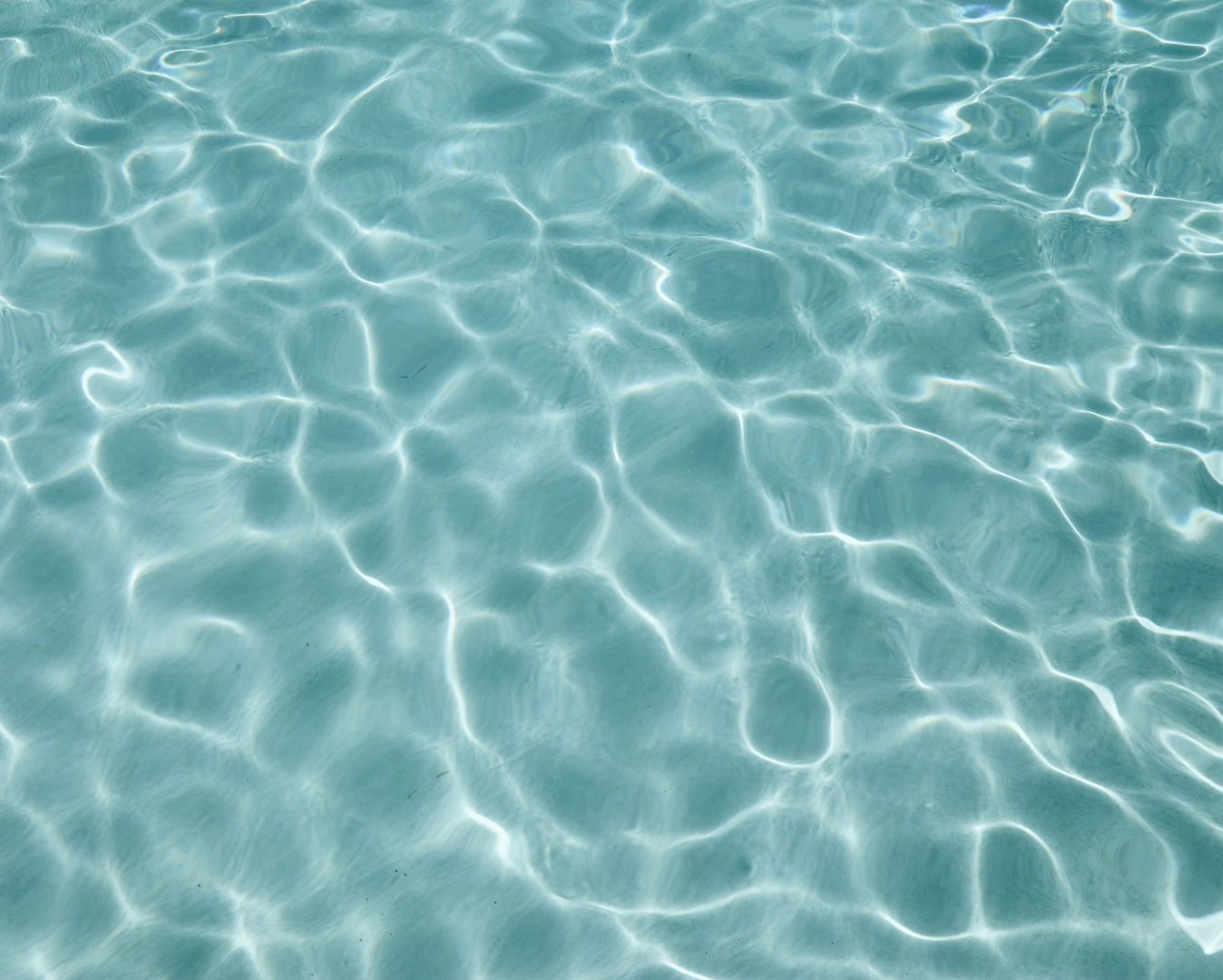Close-up of sparkling blue pool water