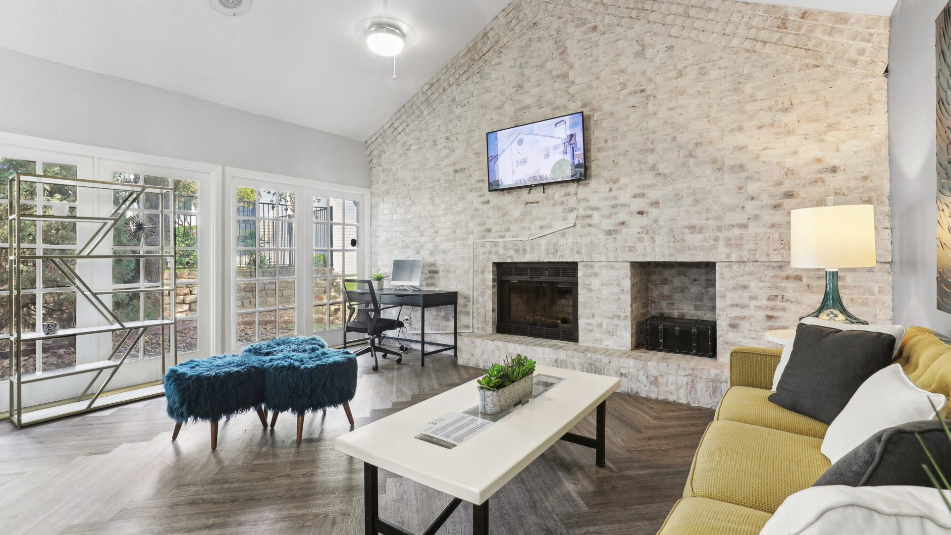 a living room with a fireplace and a television at The 3001 Crystal Springs