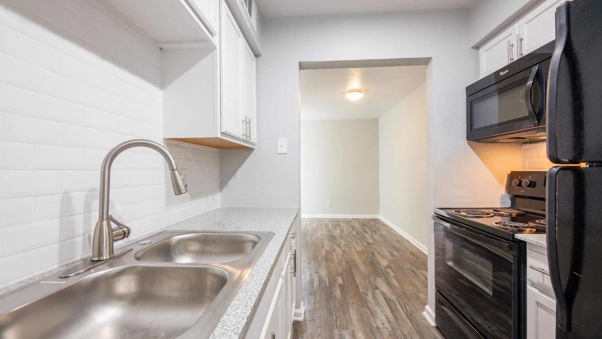 kitchen stainless sink white backsplash