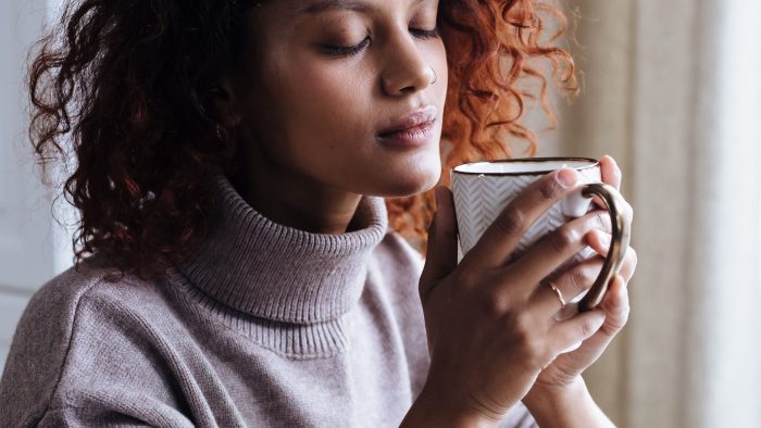 The Enclave - Woman drinking Coffee