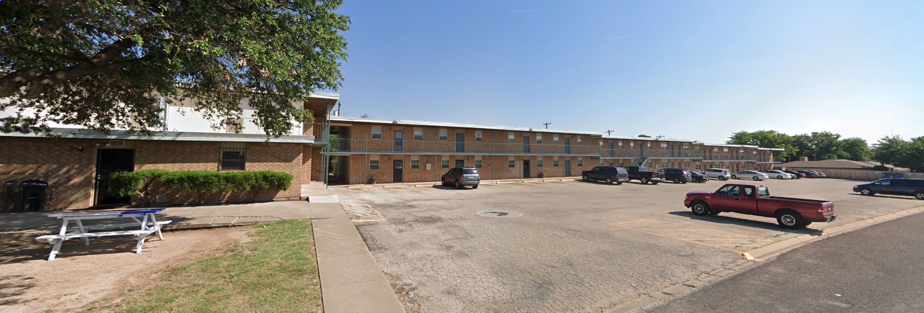 a large parking lot with cars parked in front of it at The Legacy Terrace