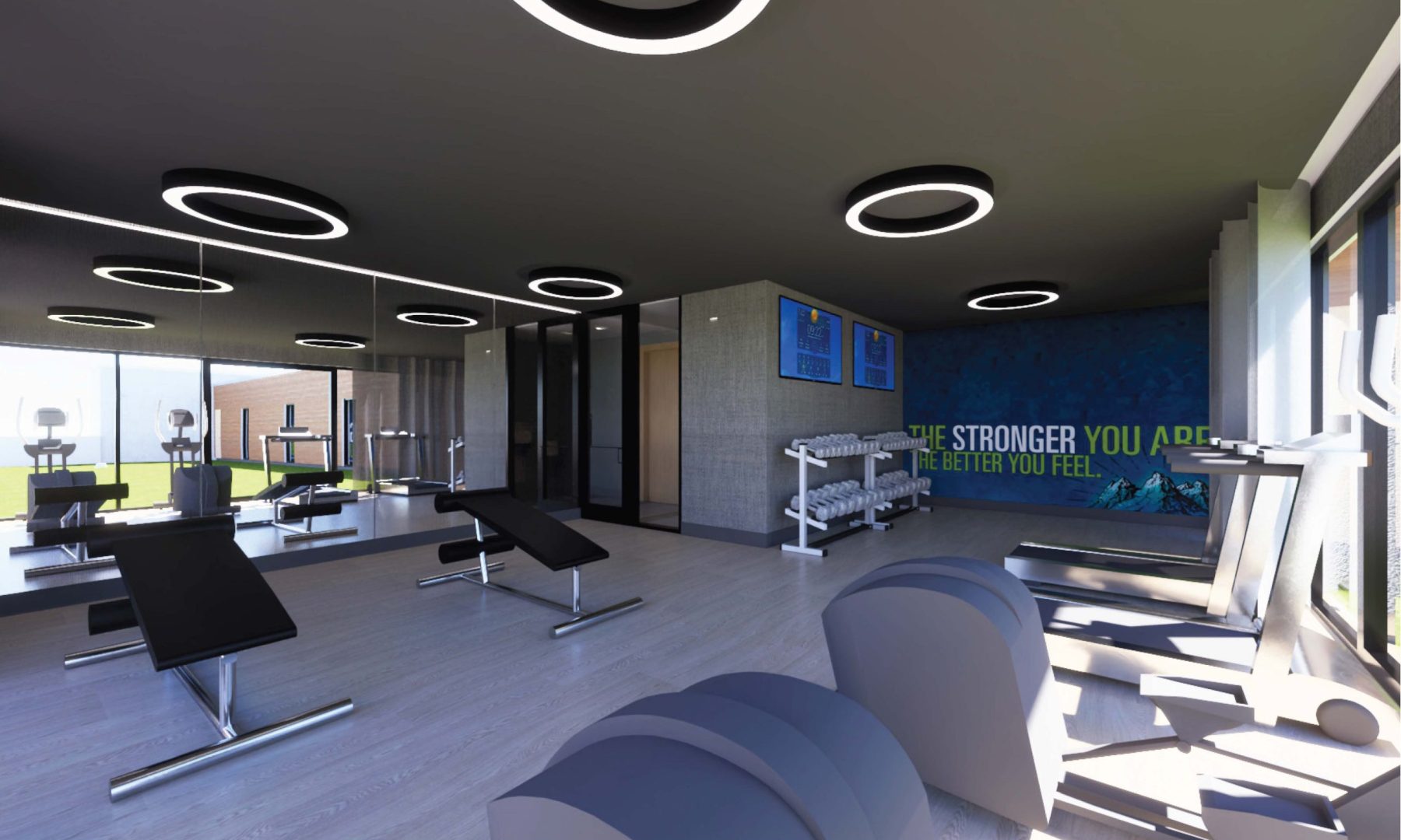 a gym room with a large screen and exercise equipment at The  Delaware