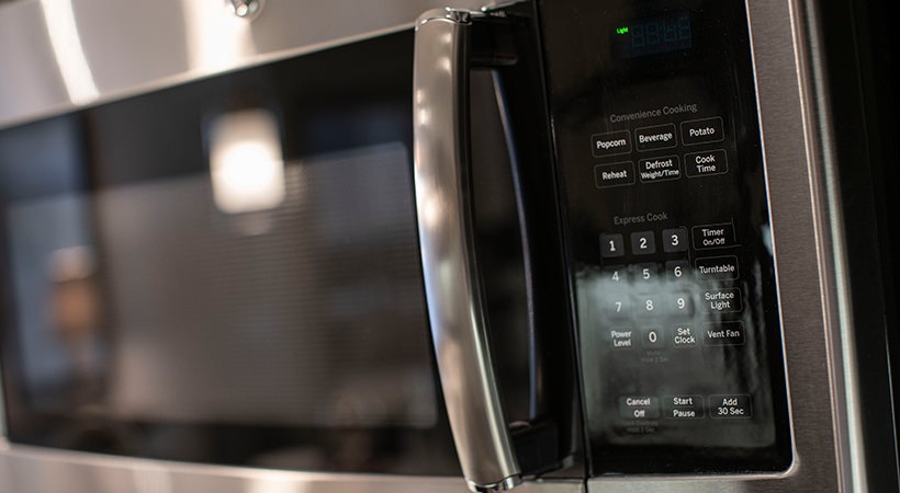 a close up of a microwave oven with a digital display at The Live Oak at  Branch