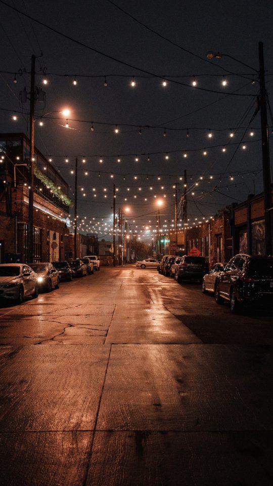 cars parked on side of the road during night time