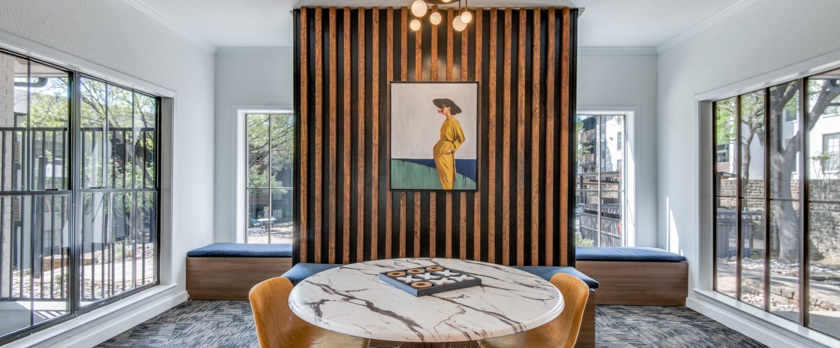 a dining room with a table and chairs at The  Kace