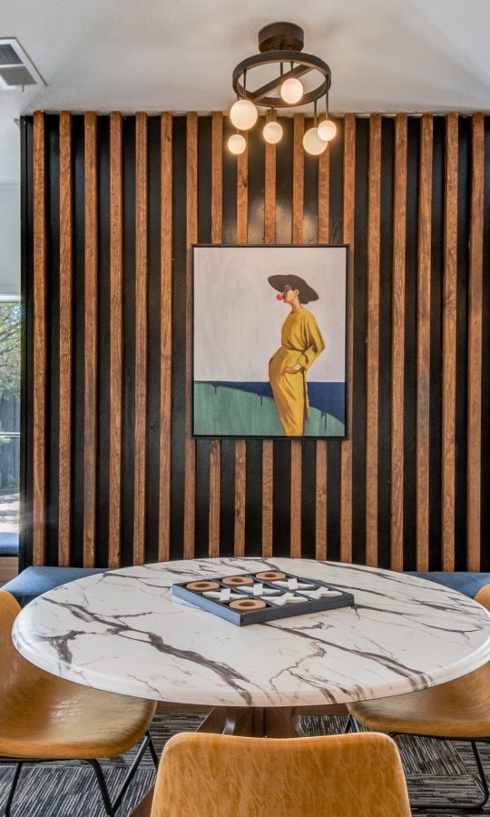 a dining room with a table and chairs at The  Kace