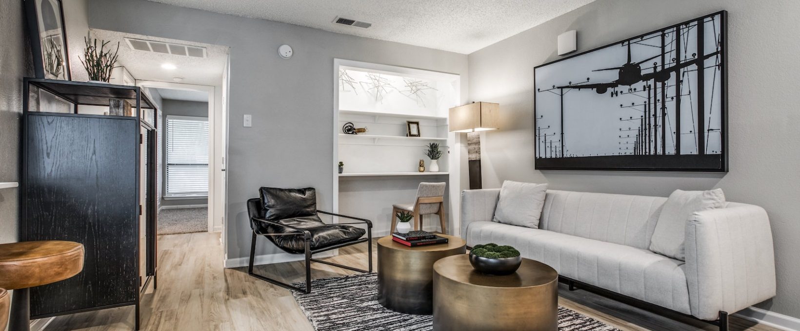 the living room has a white couch and coffee table at The  Republic East & West