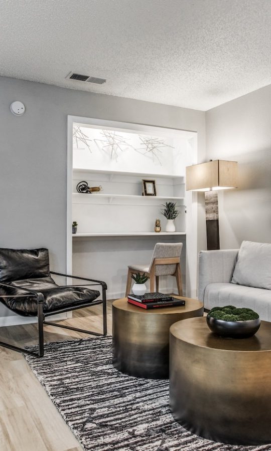 the living room has a white couch and coffee table at The  Republic East & West