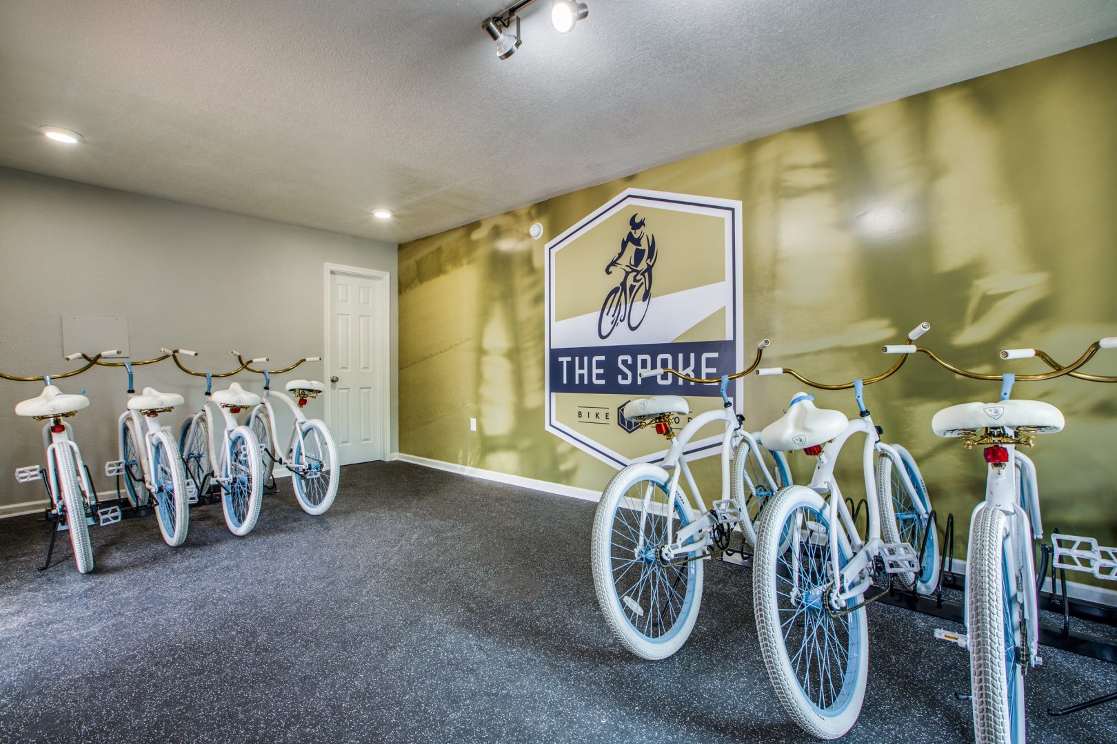 a room with bicycles and a sign that says the bike at The WESTON