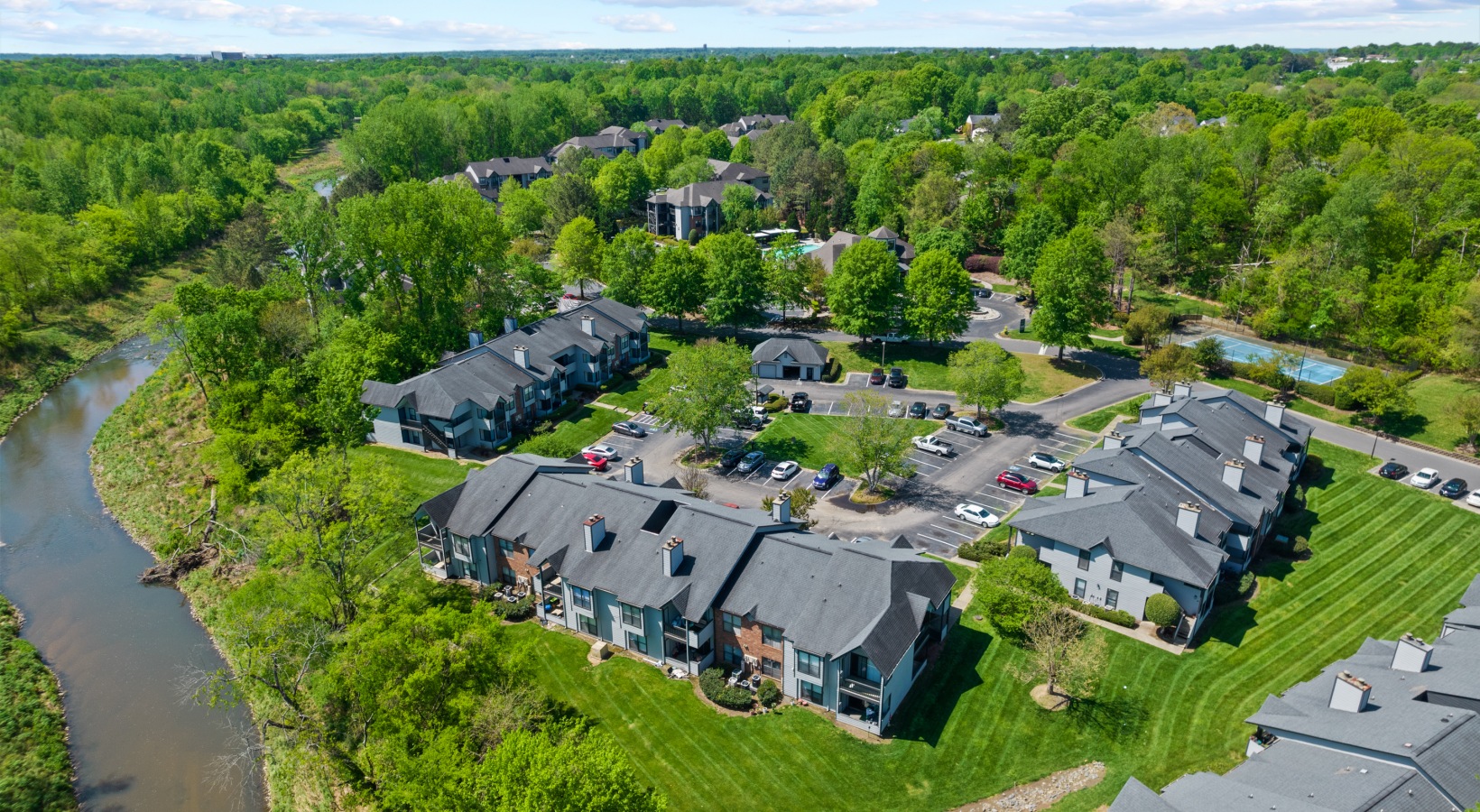 an aerial view of the river and houses at The Landon