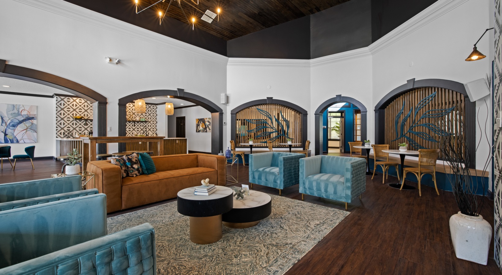 the lobby of a hotel with blue couches and chairs at The Landon