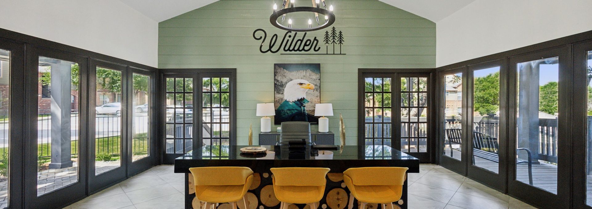 the dining room has a large table and chairs at The Wilder