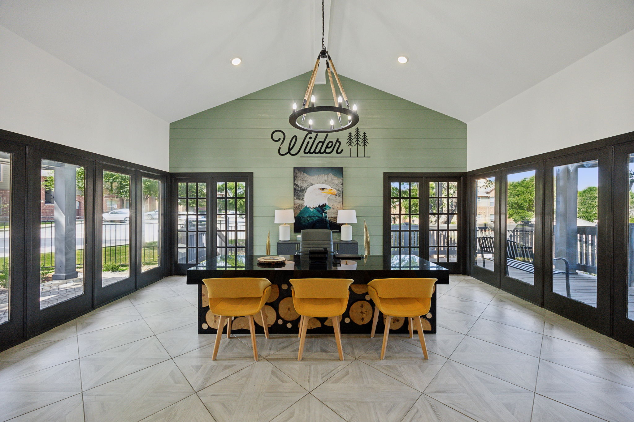 the dining room has a large table and chairs at The Wilder
