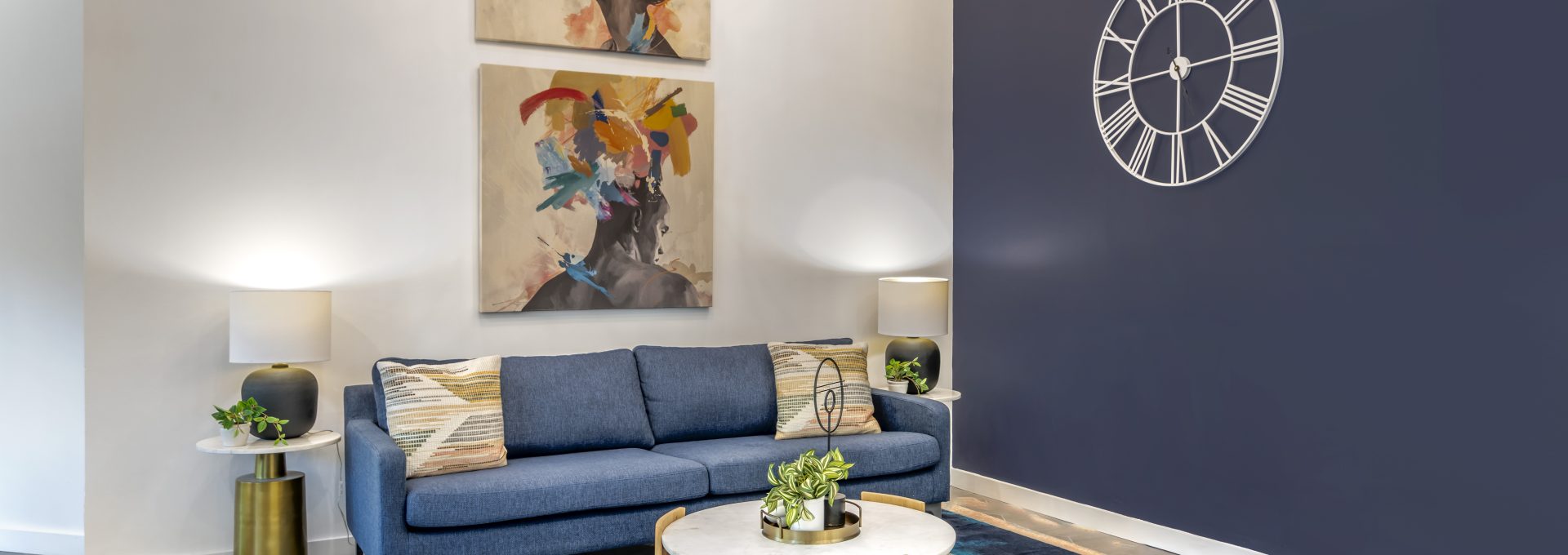 a blue couch and coffee table in a living room at The  Jaxon