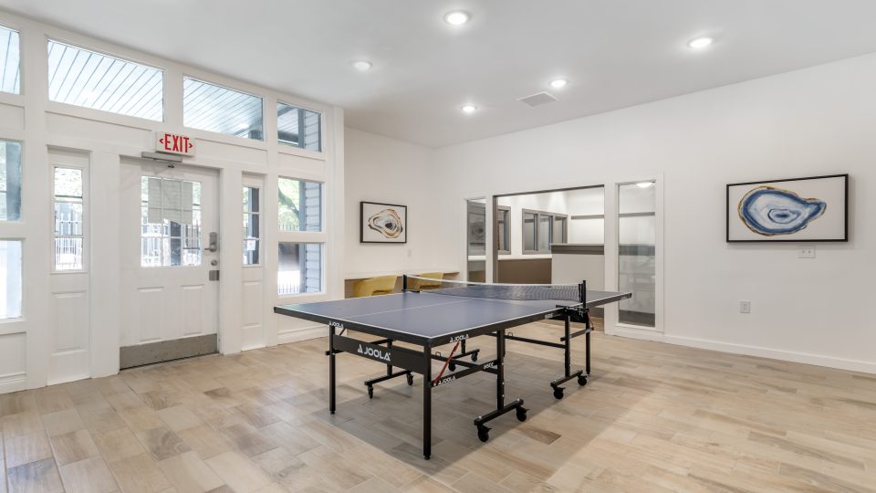 a ping pong table in a large room at The  Jaxon