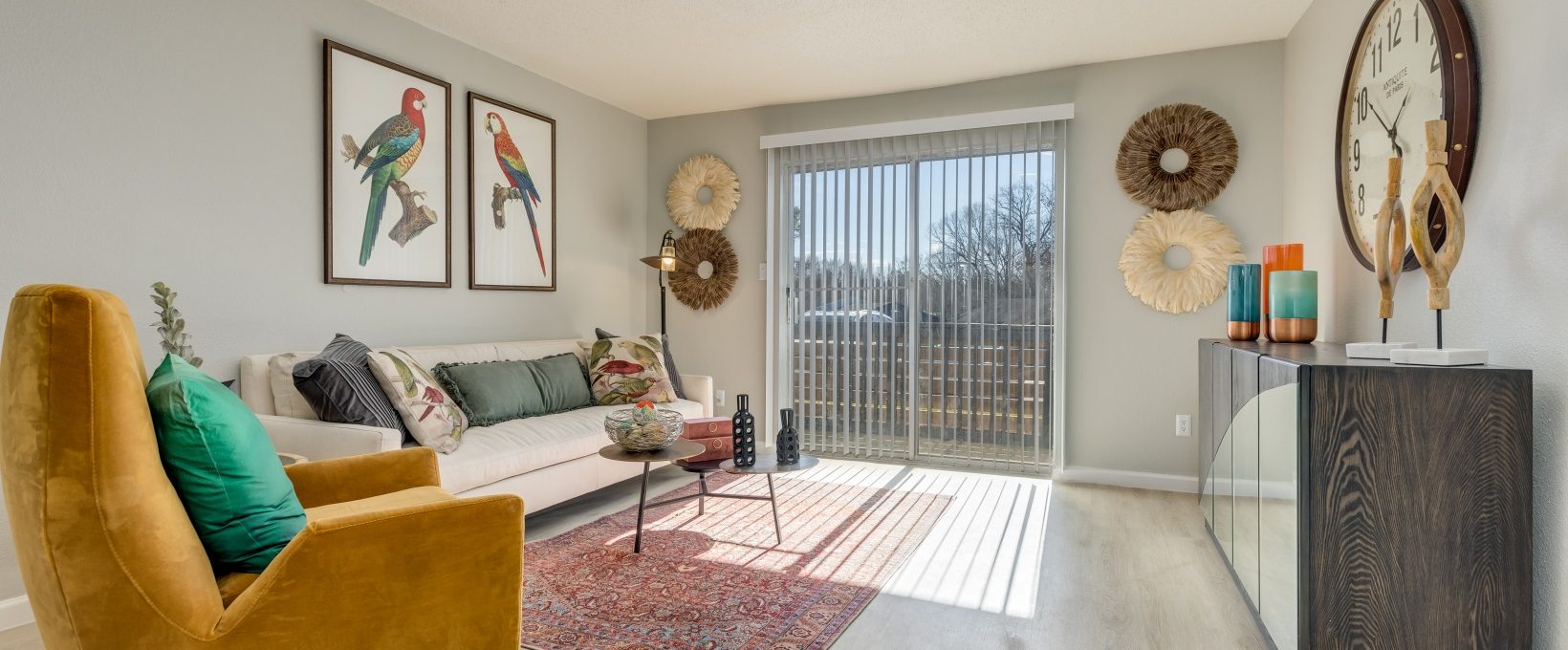 a living room with a couch, chair and a picture frame at The Winslow