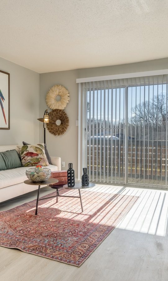 a living room with a couch, chair and a picture frame at The Winslow