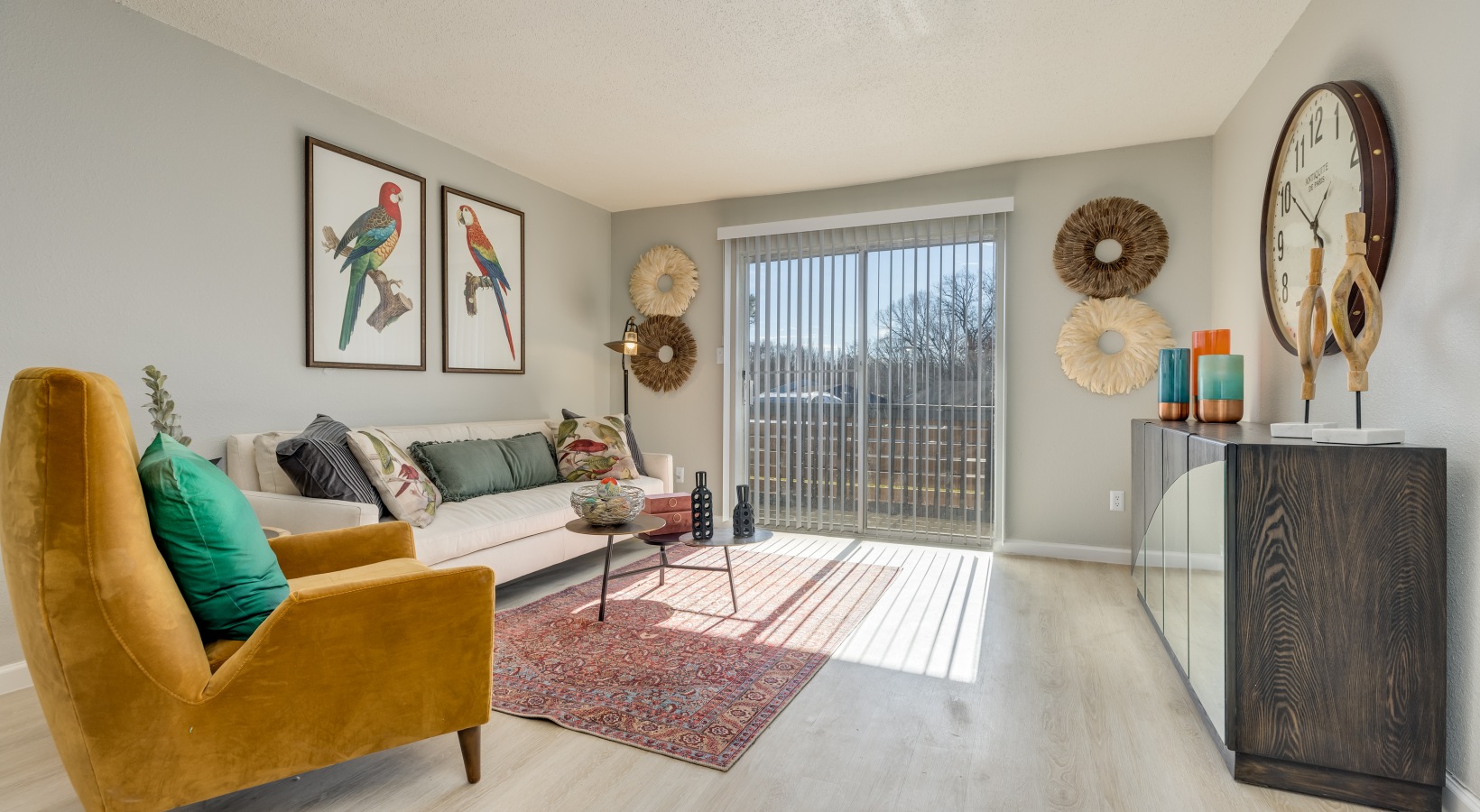 a living room with a couch, chair and a picture frame at The Winslow