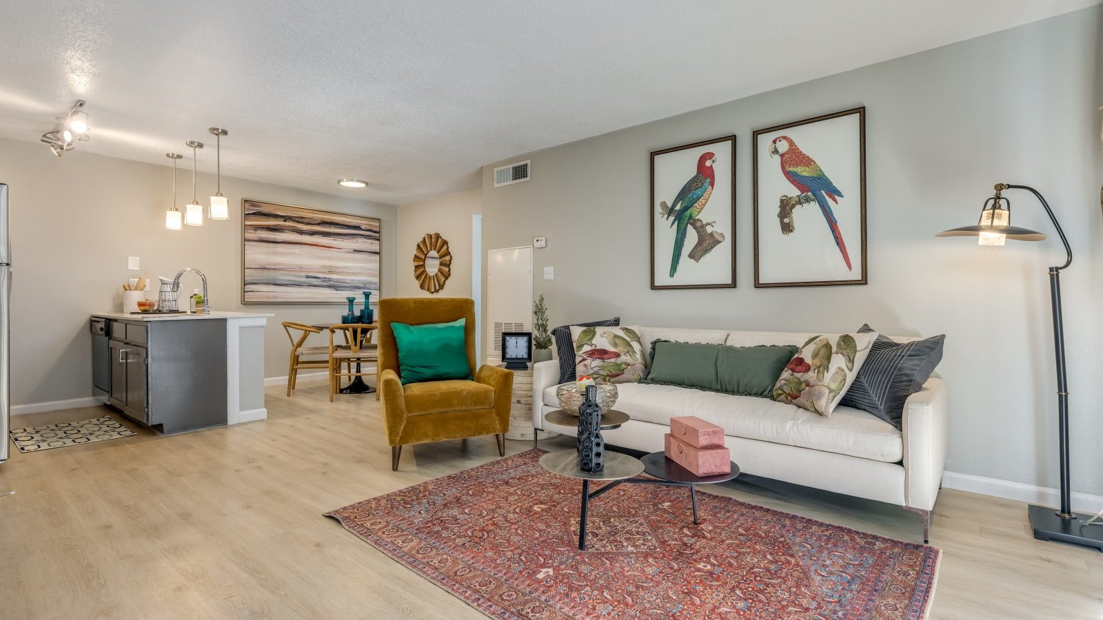 a living room with a couch, coffee table and a rug at The Winslow