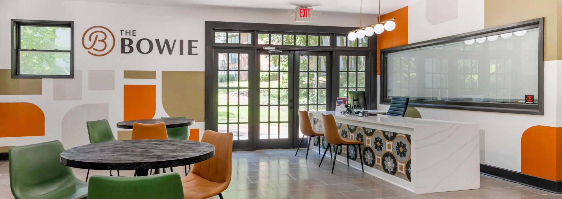 the bowie office features a large table and chairs at The  Bowie