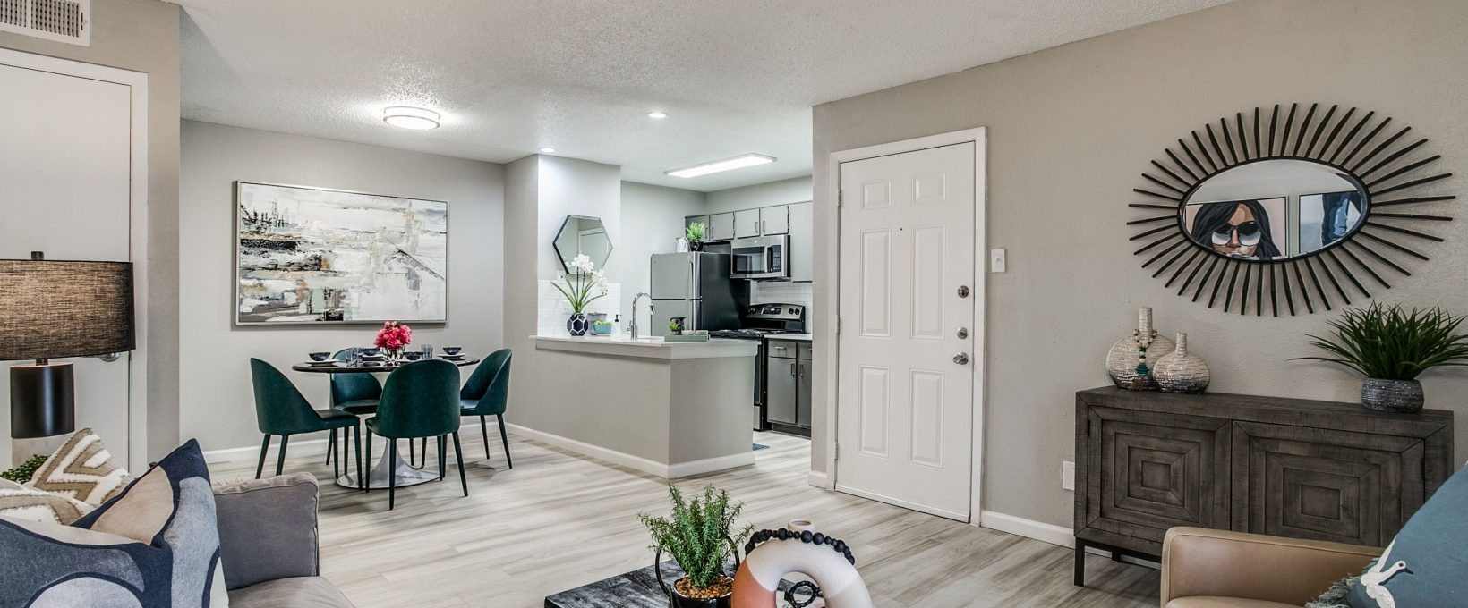 a living room and kitchen area at The Melville