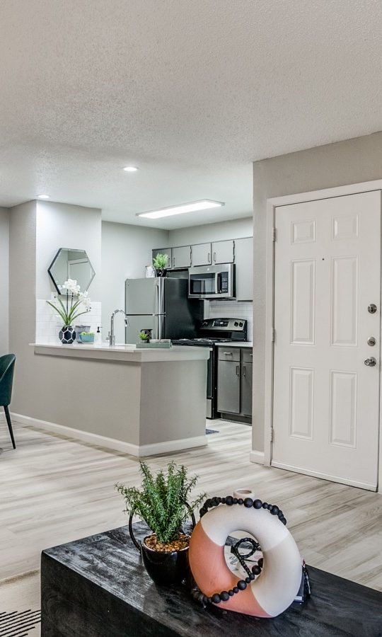 a living room and kitchen area at The Melville