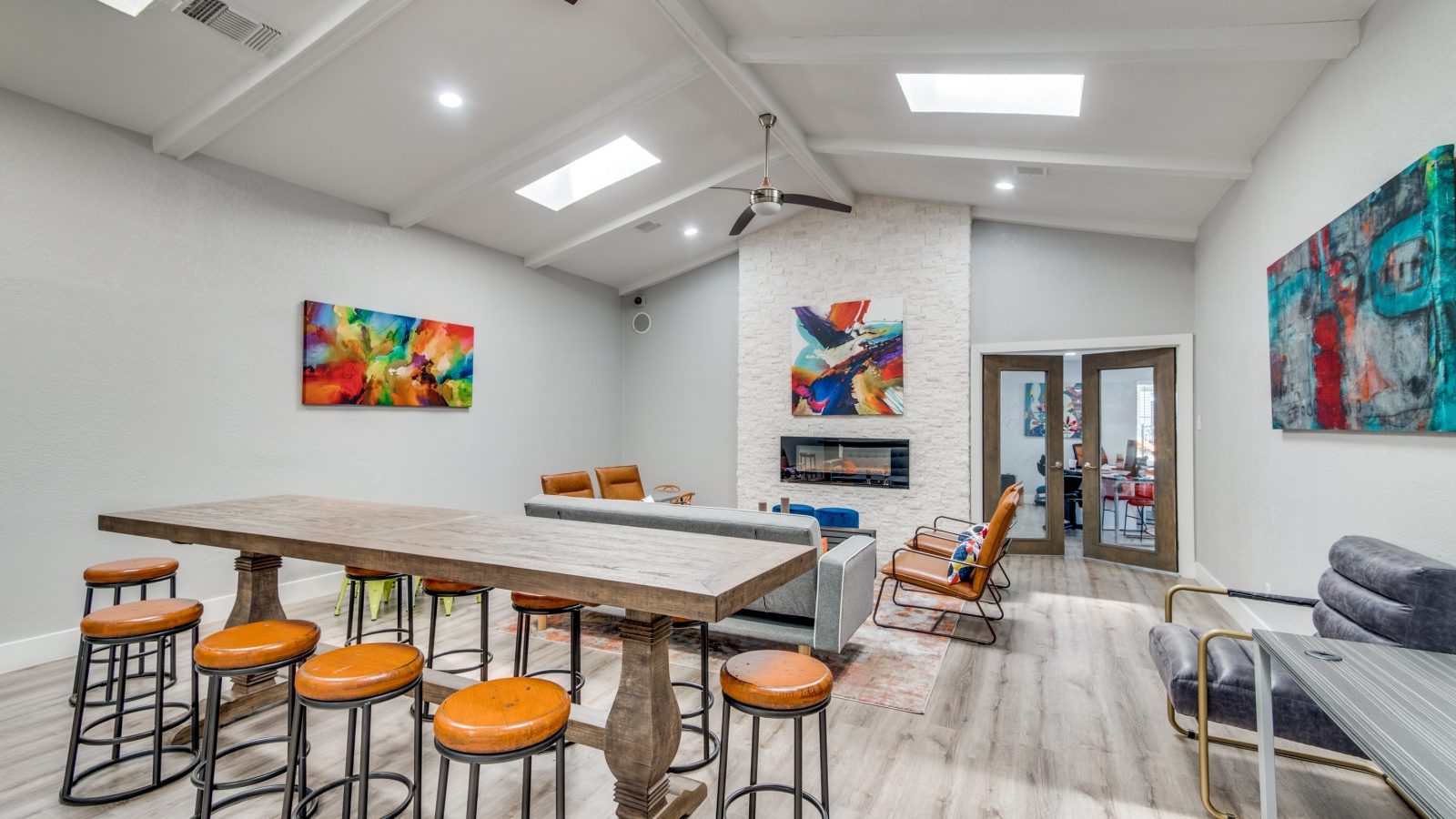 a living room with a pool table and bar stools at The Booker