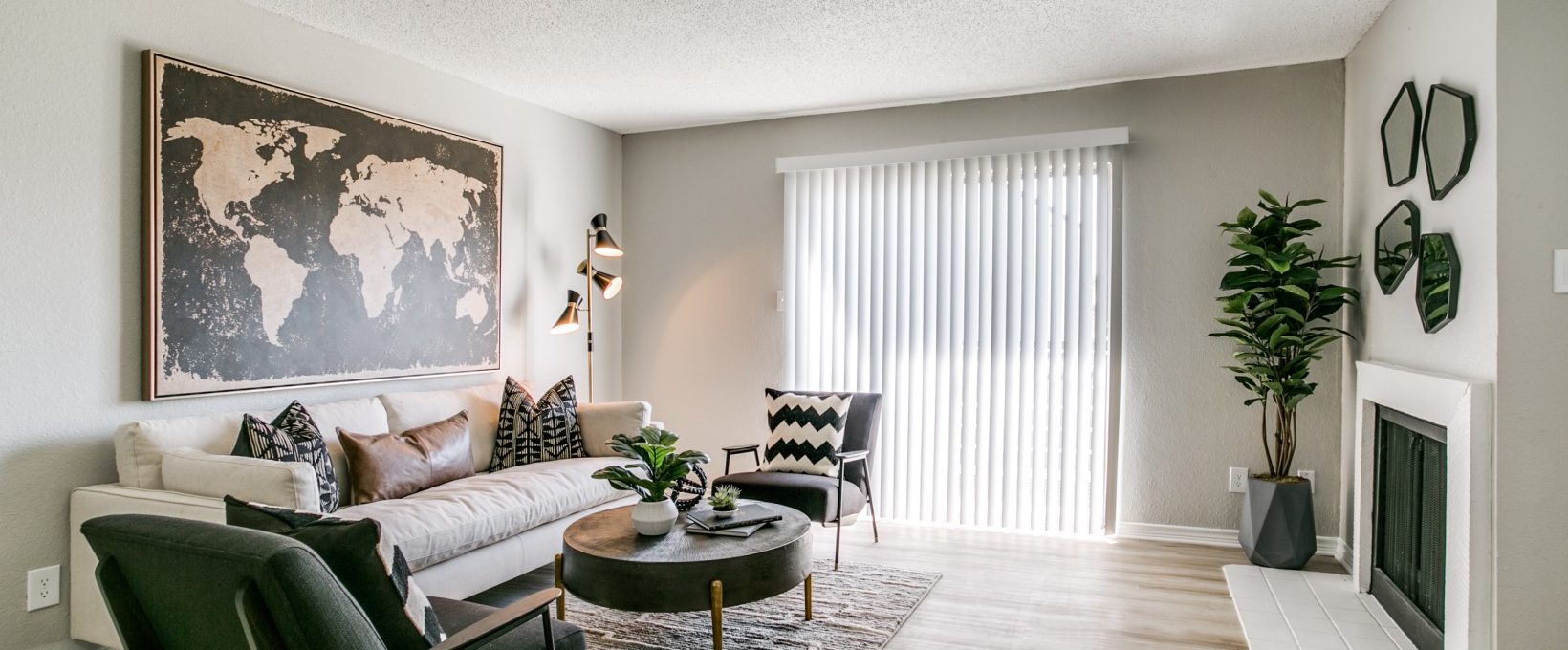 a living room with a large map on the wall at The  Holden