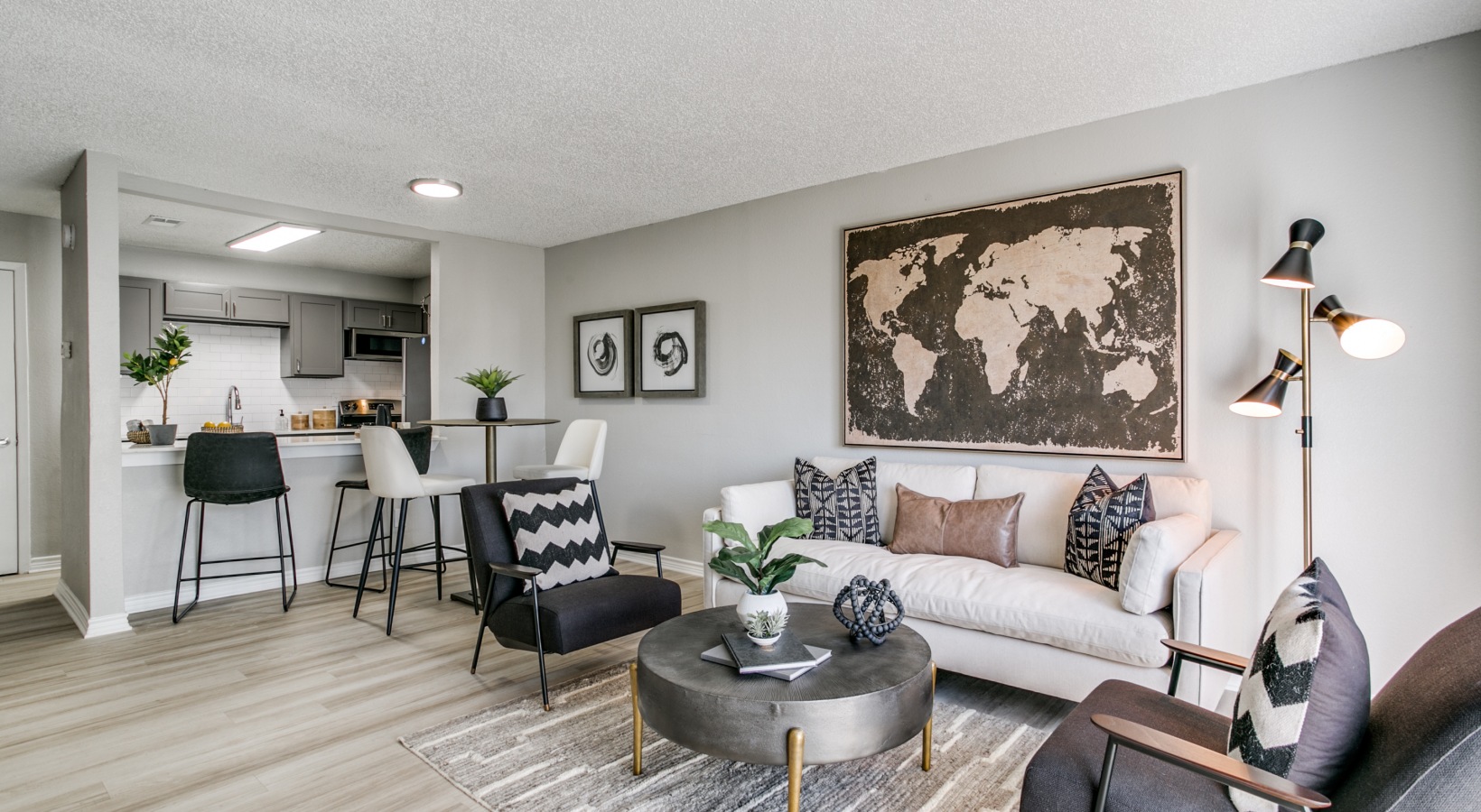 a living room with a couch, coffee table and a large map at The  Holden