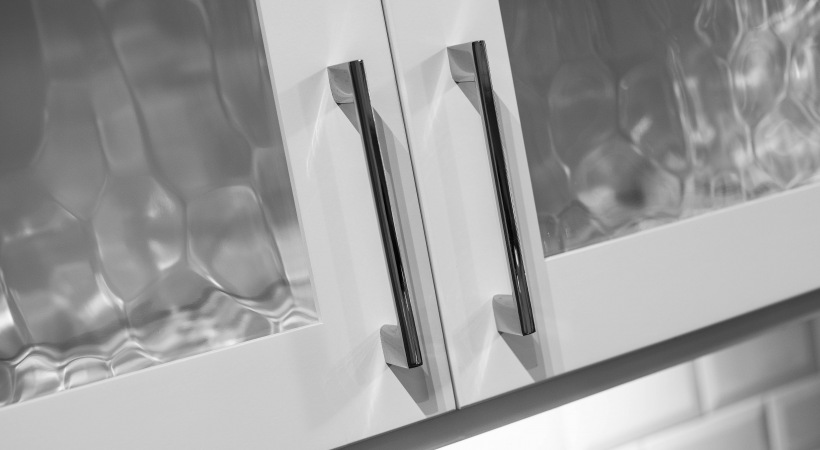 a close up of a kitchen cabinet door with glass handles at The Ash at  Branch