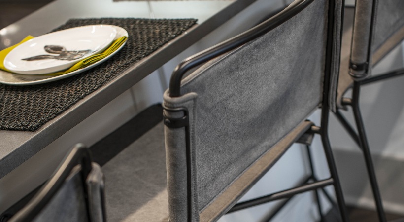 a black and gray bar stool with a plate on it at The Ash at  Branch