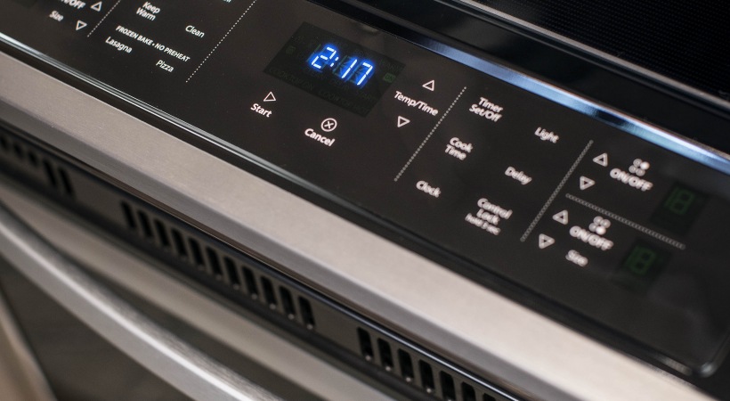 a close up of a digital clock on a stove at The Ash at  Branch