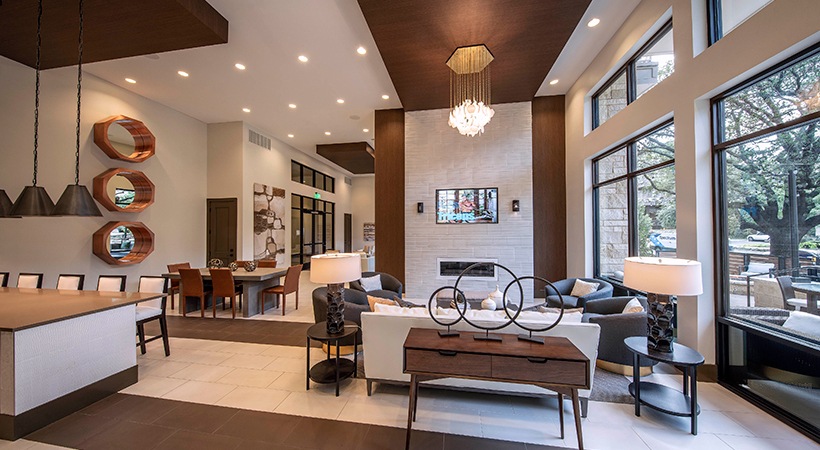 the living room has a large window and a fireplace at The Ash at  Branch