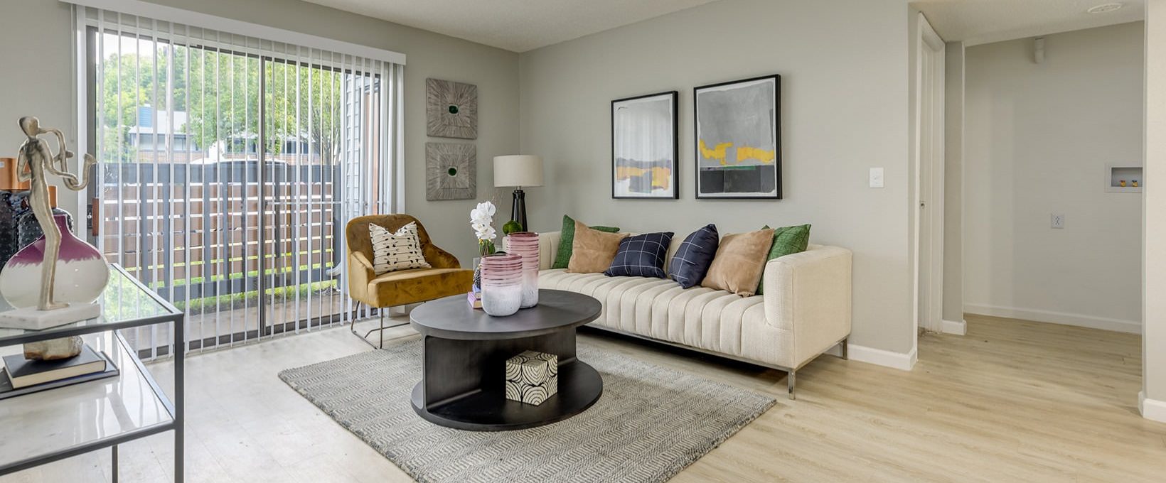 a living room with a couch, coffee table and television at The Grant Valley Ranch