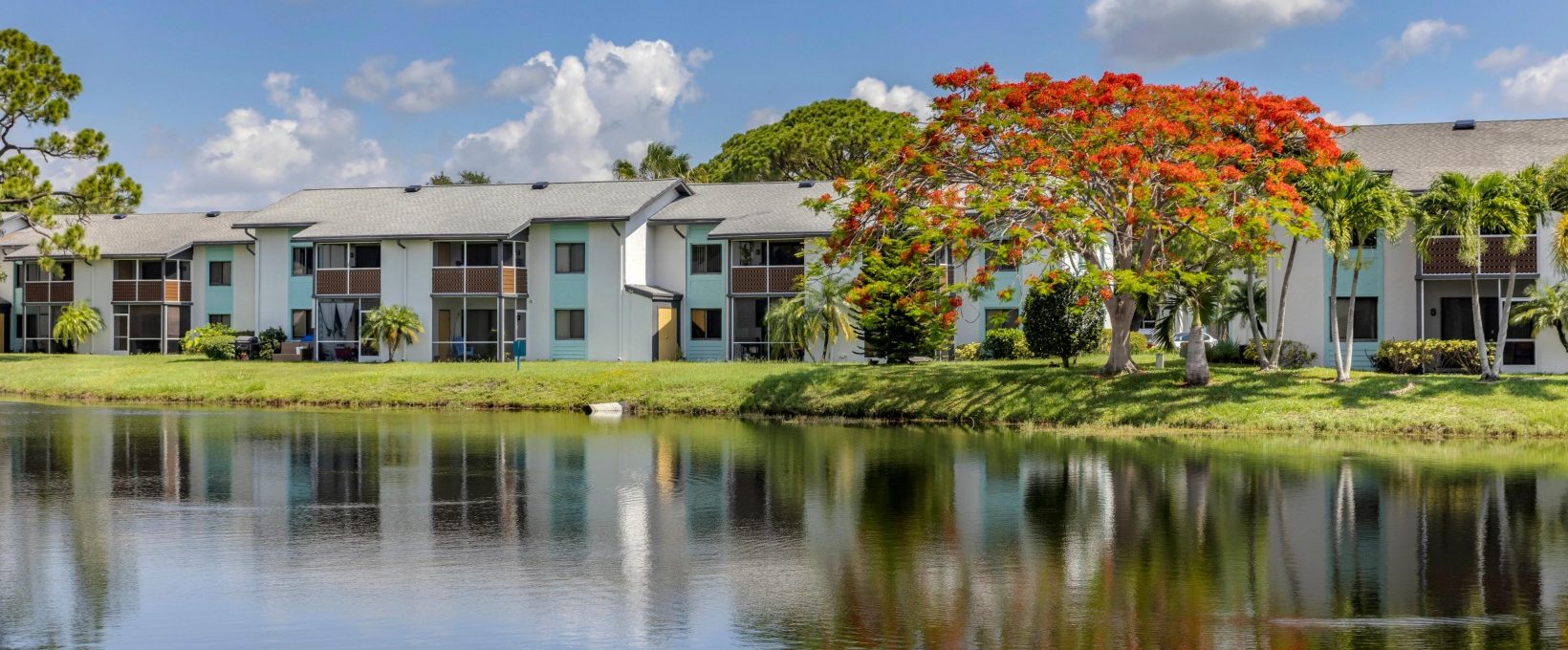 the view of an apartment complex from the water at The Marino
