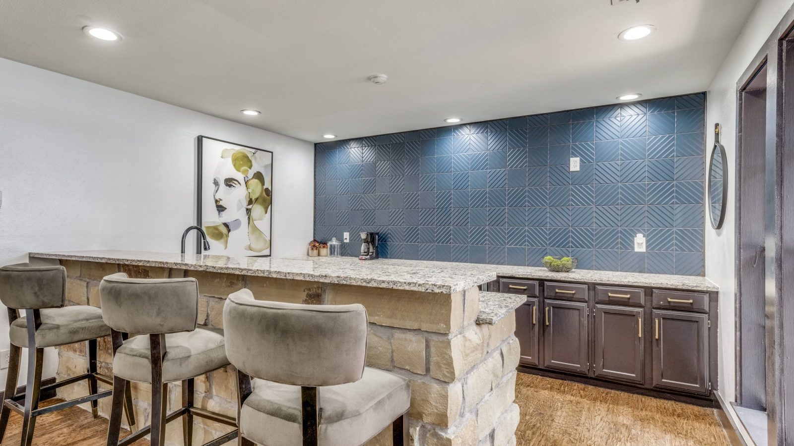 a kitchen with a bar and blue tile at The  Durham