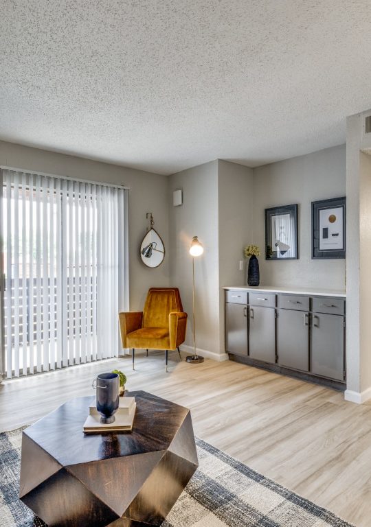 the living room has hardwood floors and a large window at The  Durham