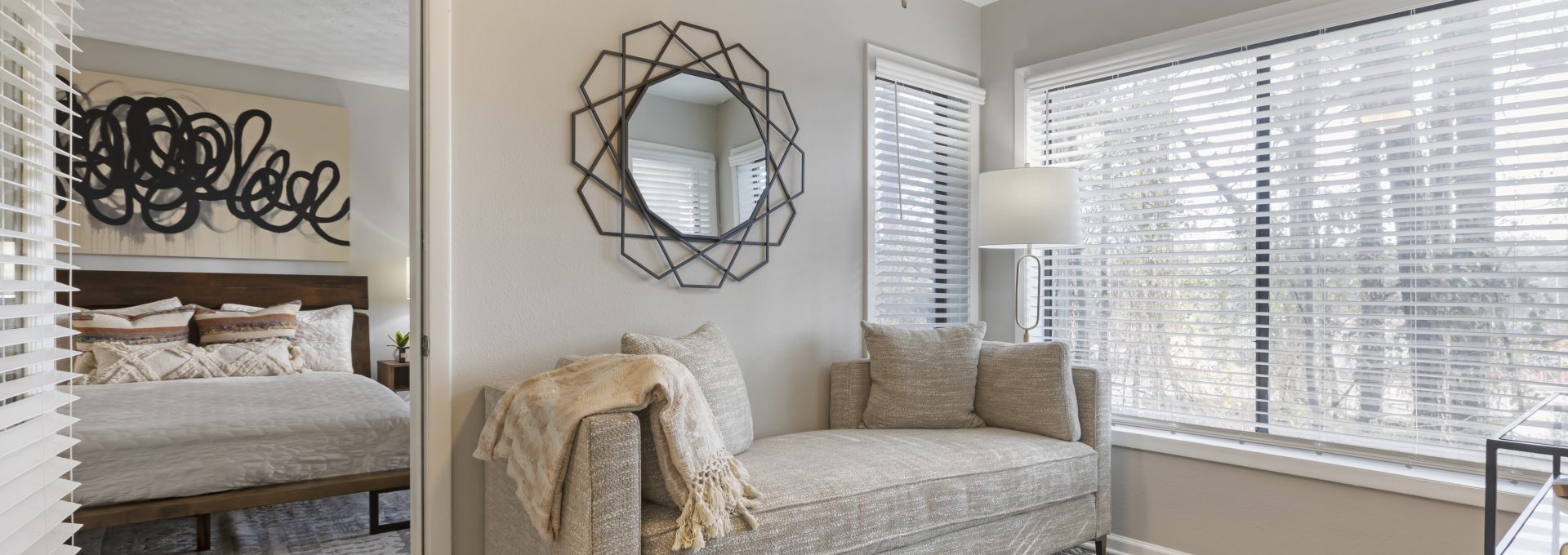 a bedroom with a couch and a fan at The  Breck