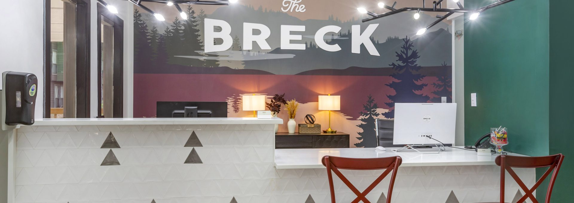the breckenridge hotel lobby with a sign that says breckenridge at The  Breck