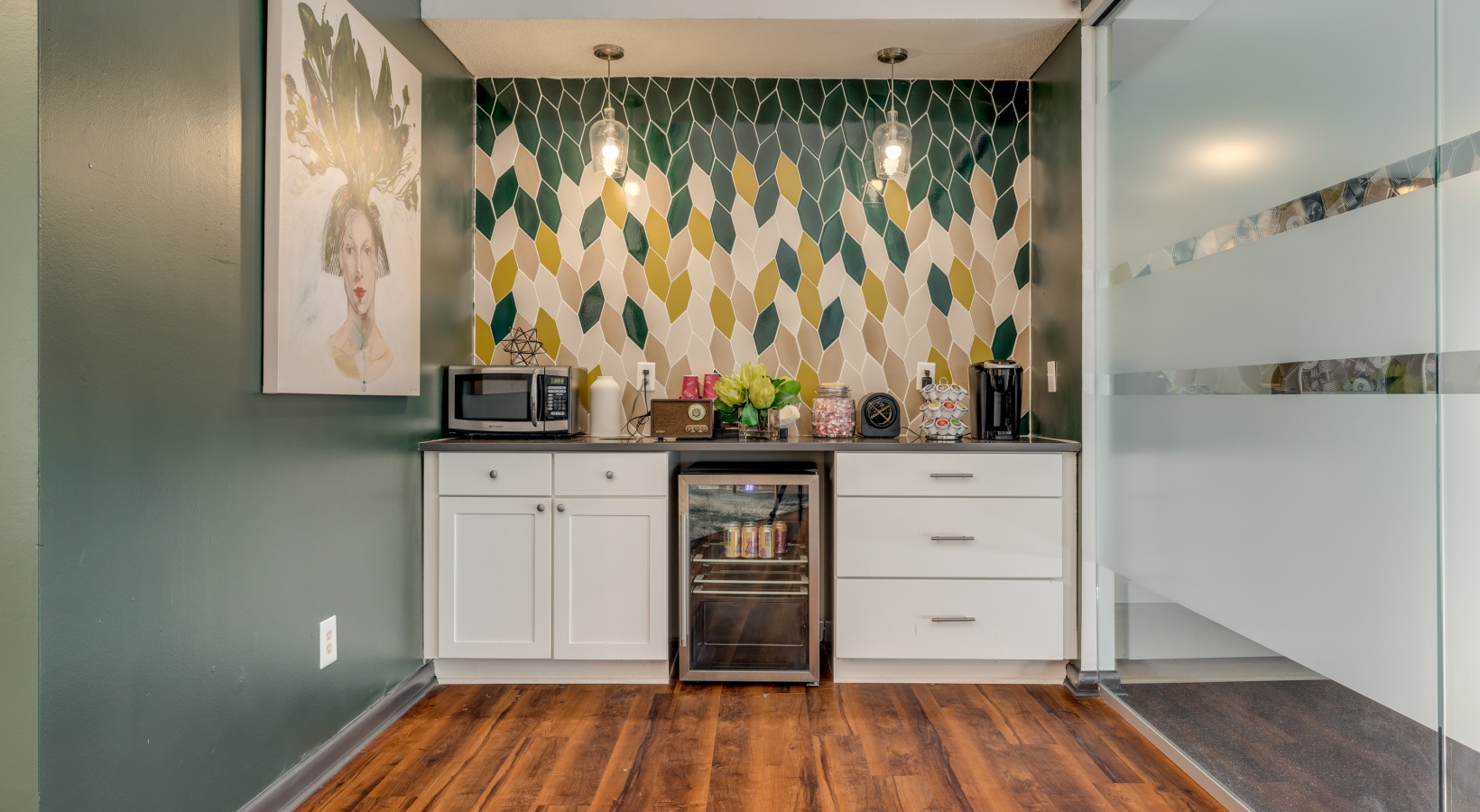 a kitchen with a green and yellow wallpaper at The Quinn on Ravenglass