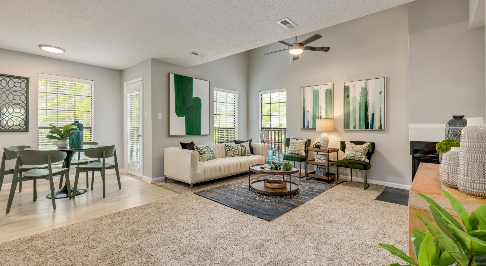 a living room with green carpeting and white furniture at The Quinn on Ravenglass