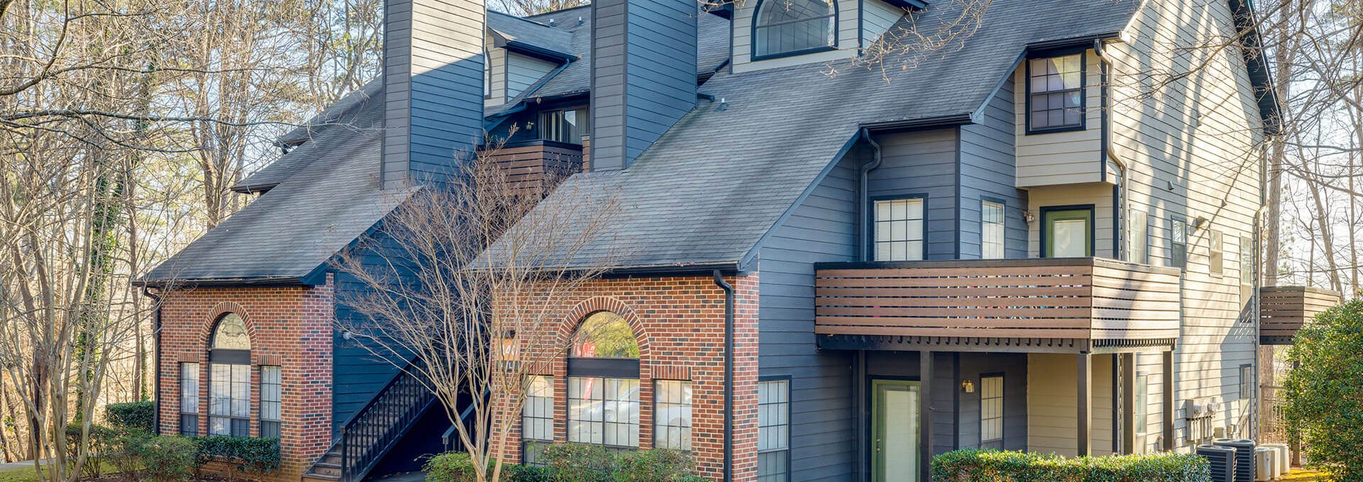 the front of a two story apartment building at The  Quinn on Ravenglass