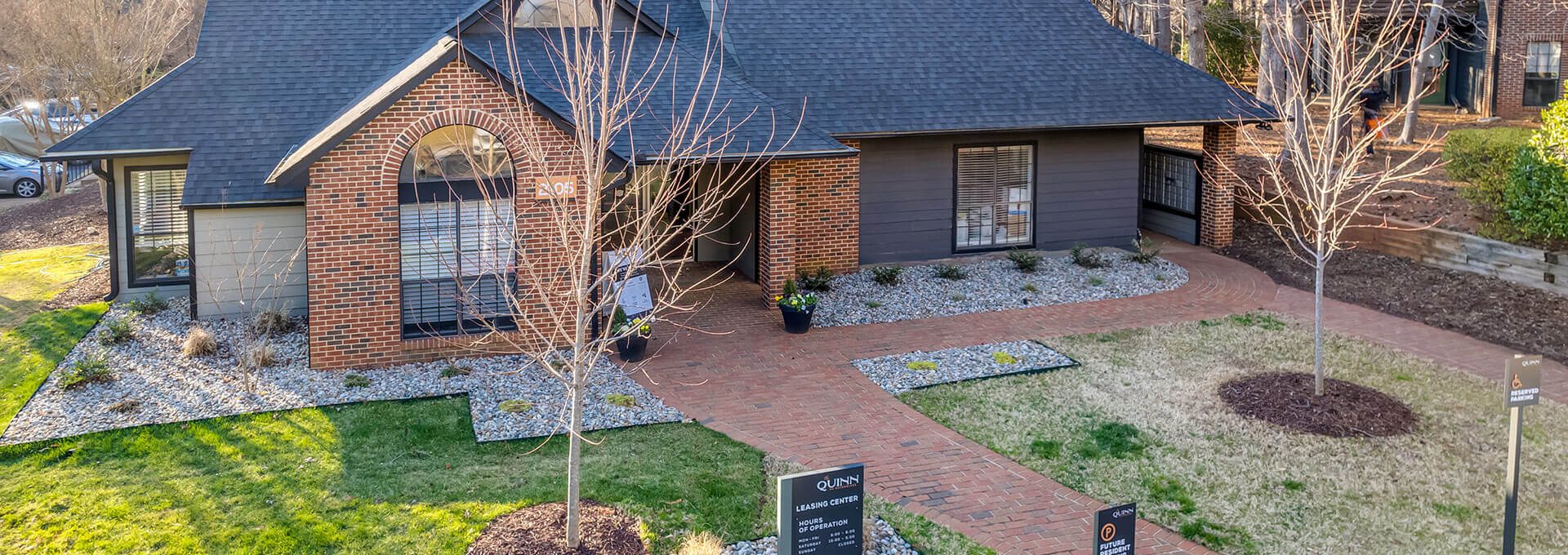 a home with a driveway and grass in the front yard at The  Quinn on Ravenglass