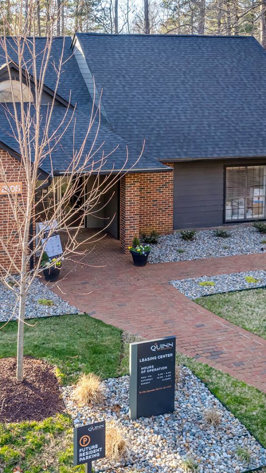 a home with a driveway and grass in the front yard at The  Quinn on Ravenglass