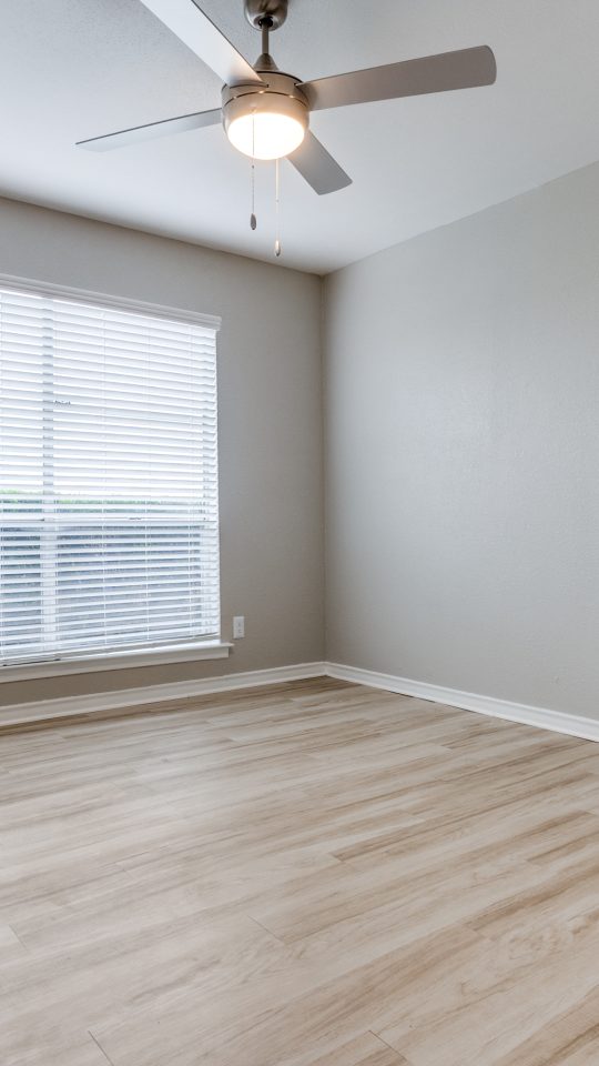 empty room with ceiling fan and hardwood floor at The Las Ventanas